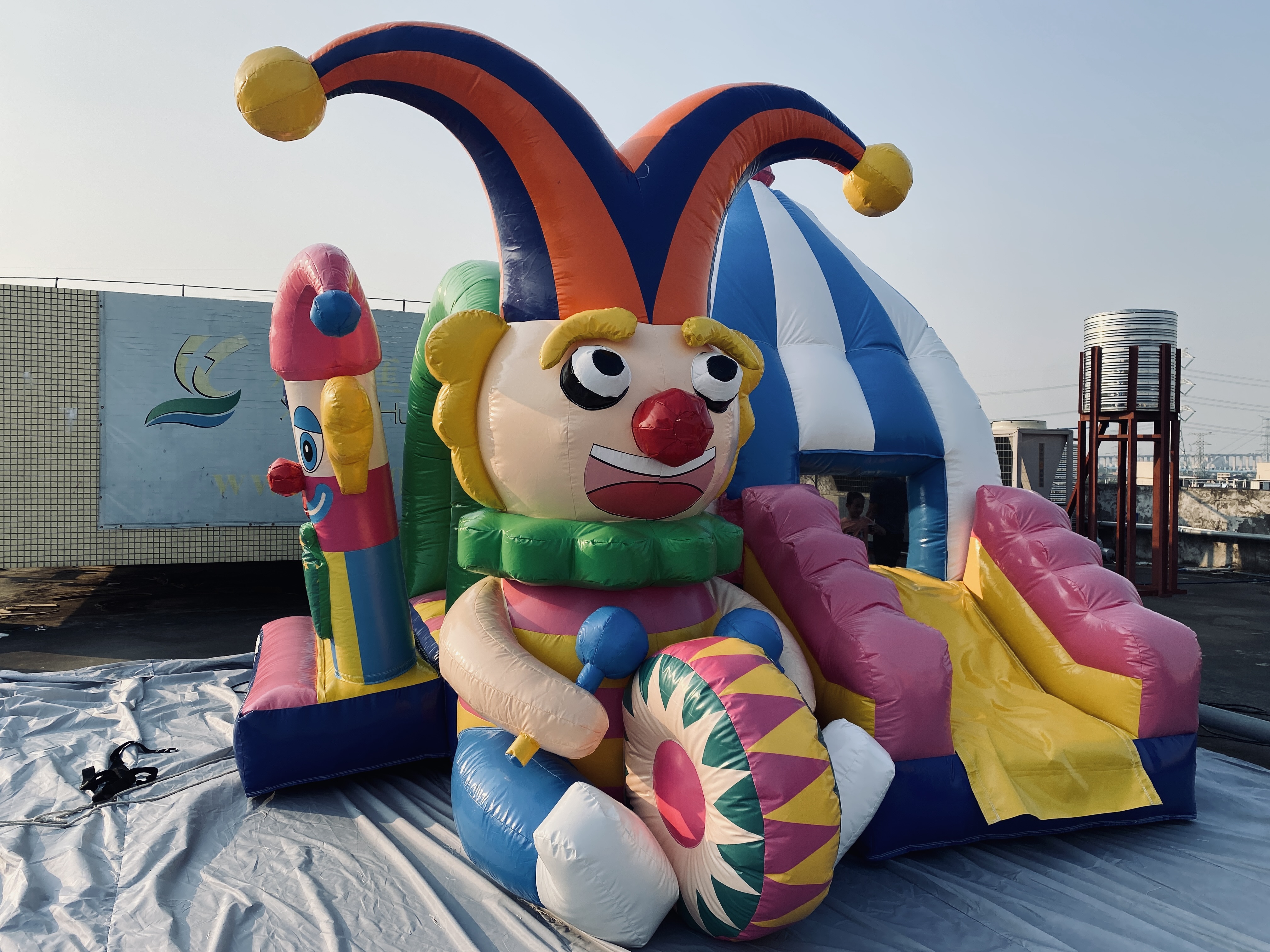 Inflatable clown jumping bed slide